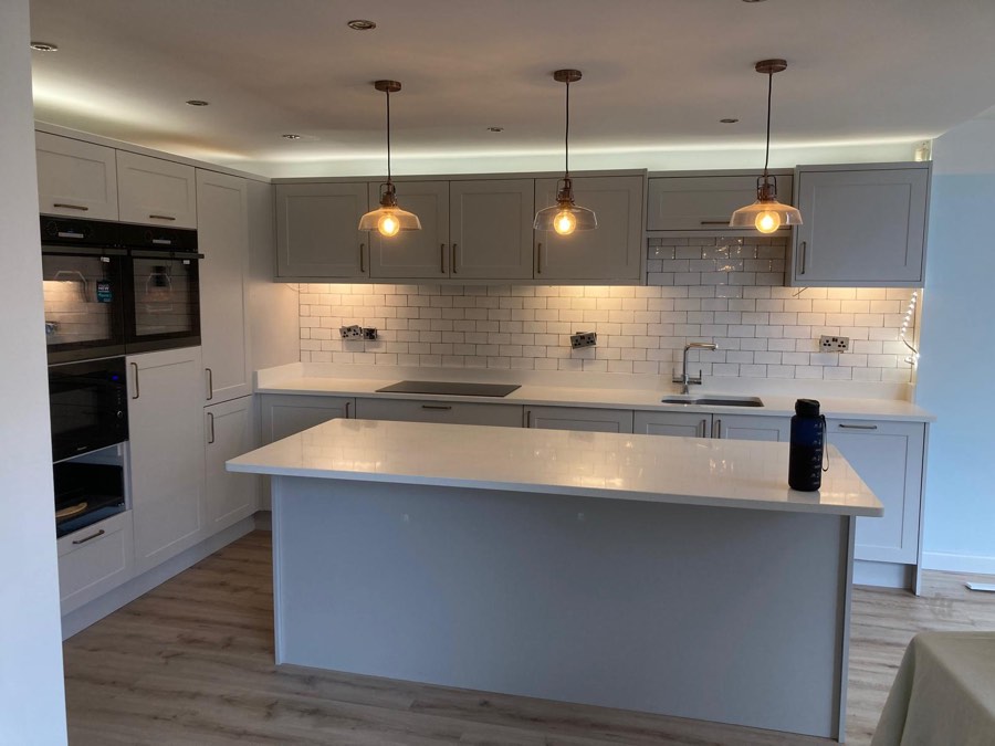 Recently fitted kitchen with island and pendant lights